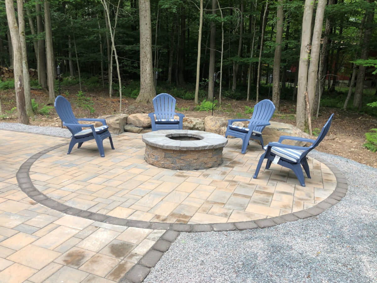 Natural stone water feature with cascading waterfall in backyard landscape